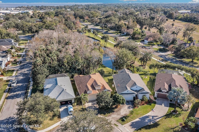 drone / aerial view with a water view