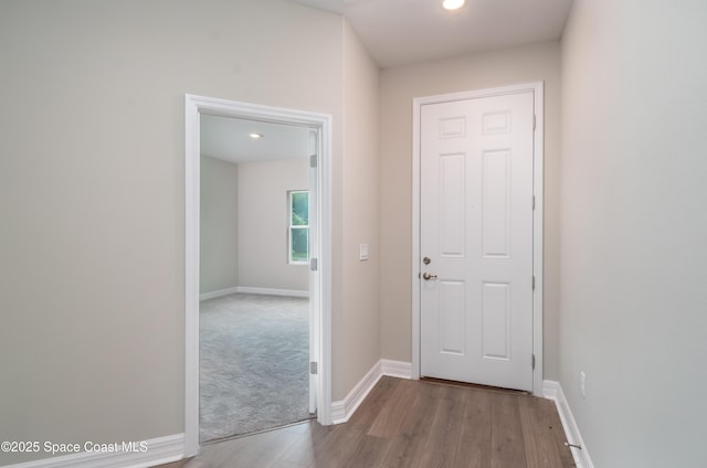 hallway with light hardwood / wood-style flooring