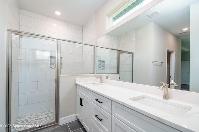 bathroom with vanity, tile patterned floors, and walk in shower