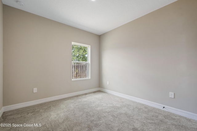 228 Dunlap Ave SE, Palm Bay, FL 32909 - carpeted empty room featuring baseboards