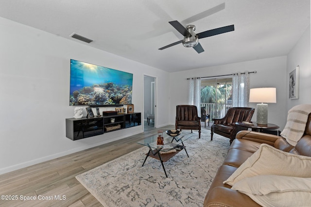 living room with light wood-type flooring and ceiling fan