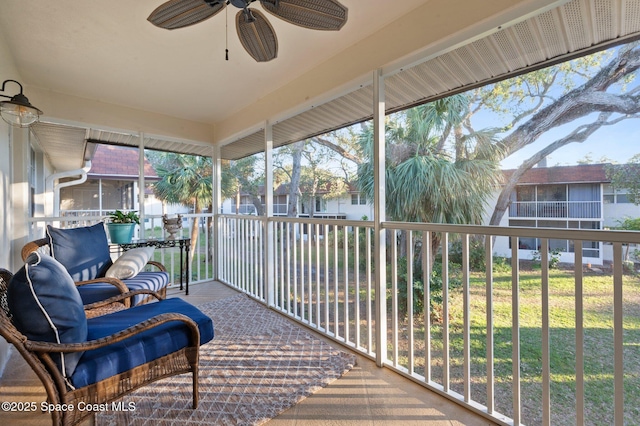 sunroom / solarium with ceiling fan