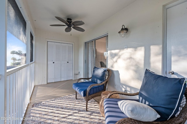 sunroom featuring ceiling fan