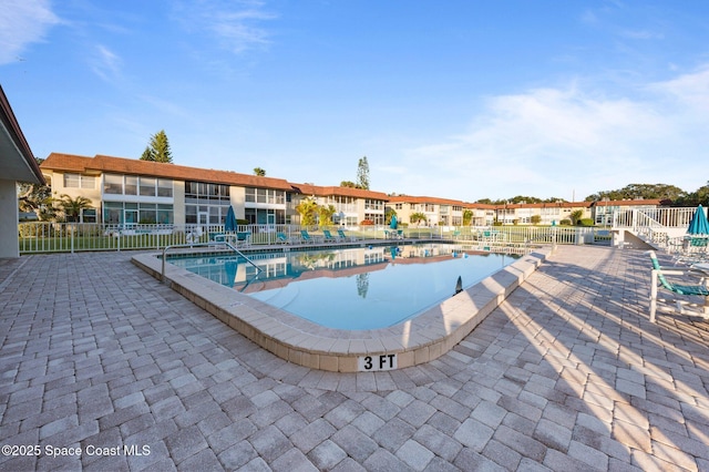 view of swimming pool with a patio area