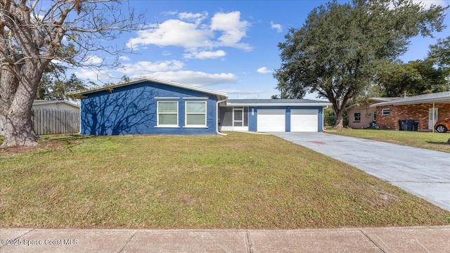 ranch-style home with a front yard and a garage