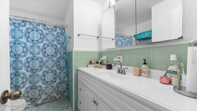 bathroom featuring backsplash, vanity, tile walls, and a shower with shower curtain