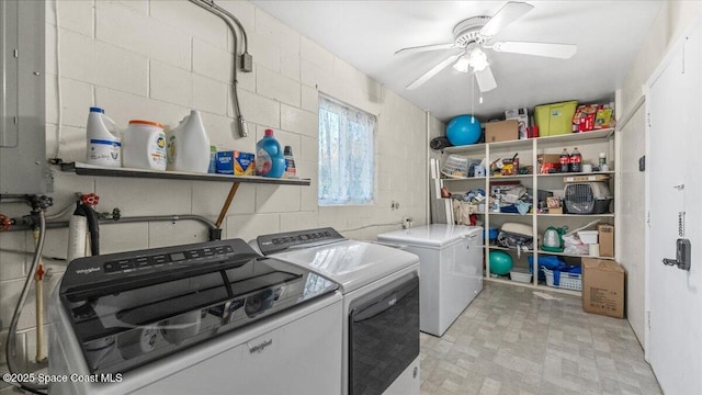 laundry area featuring electric panel, ceiling fan, and washer and dryer