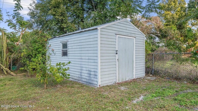 view of outdoor structure with a lawn