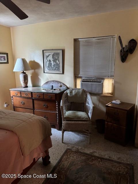 bedroom featuring ceiling fan and cooling unit