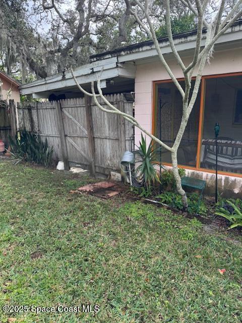 view of yard featuring a sunroom