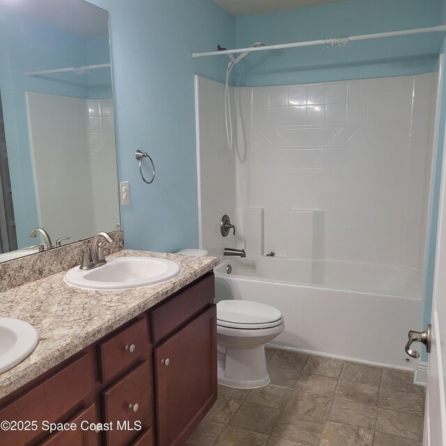 full bathroom with vanity,  shower combination, and toilet