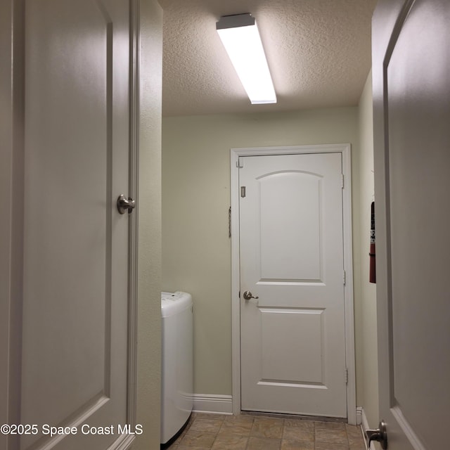 bathroom featuring a textured ceiling