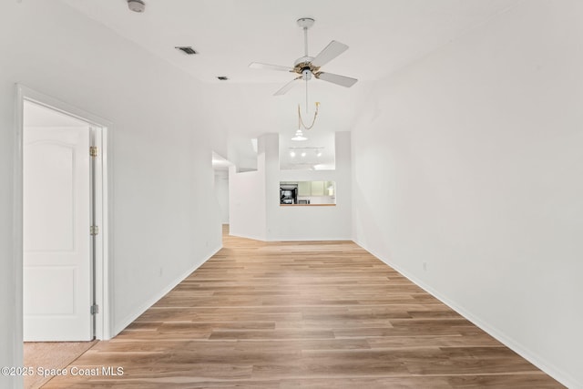 interior space with ceiling fan and light hardwood / wood-style flooring