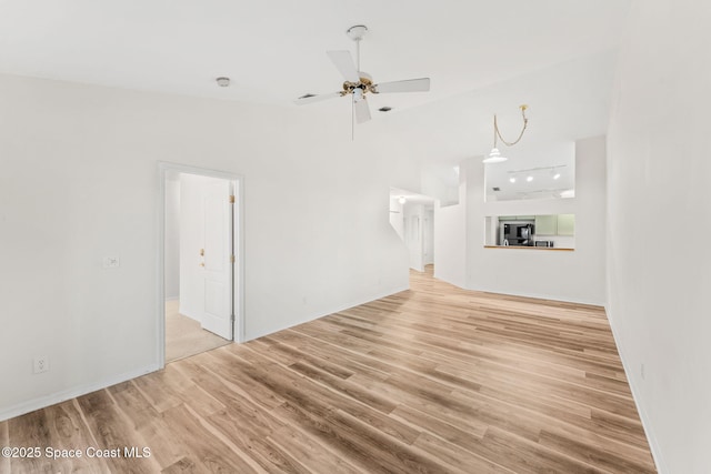 unfurnished living room featuring ceiling fan and light wood-type flooring