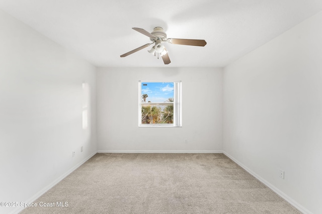 empty room with light carpet and ceiling fan