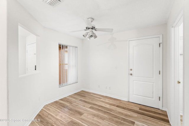 unfurnished room featuring ceiling fan and light hardwood / wood-style floors