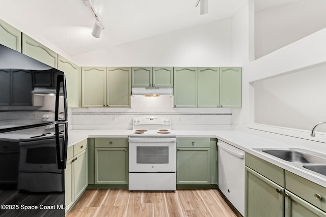 kitchen with white appliances, lofted ceiling, and green cabinetry