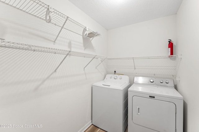 washroom with washer and clothes dryer