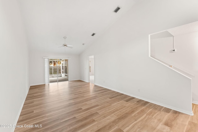 interior space featuring ceiling fan, high vaulted ceiling, and light wood-type flooring