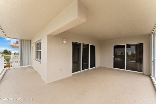 view of patio / terrace with a balcony