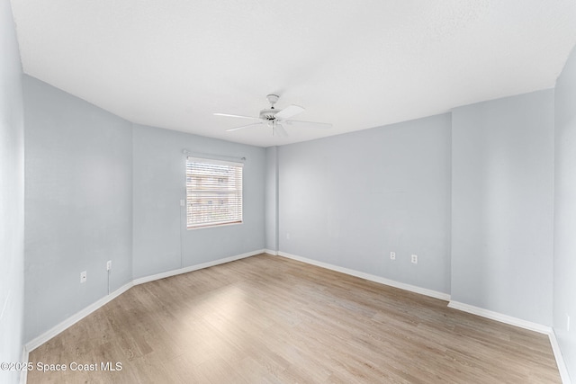 unfurnished room featuring ceiling fan and light hardwood / wood-style flooring