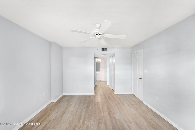 spare room with light hardwood / wood-style floors and ceiling fan