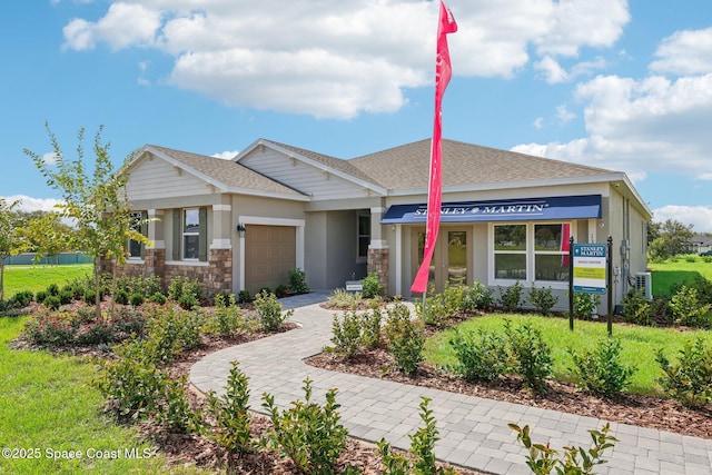 view of front of property with a garage