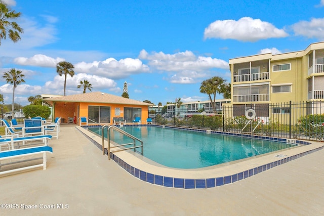 view of swimming pool featuring a patio