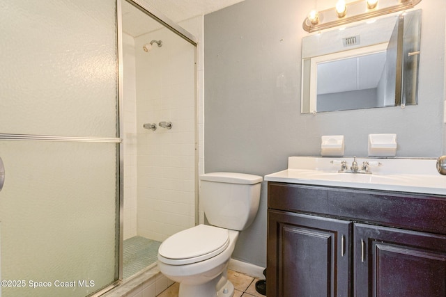 bathroom featuring toilet, an enclosed shower, tile patterned floors, and vanity