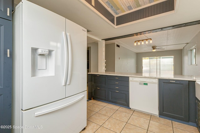 kitchen featuring white appliances, light tile patterned flooring, and ceiling fan