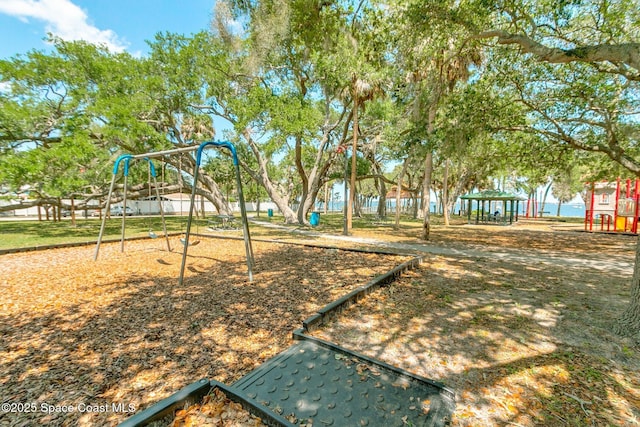 view of playground featuring a water view