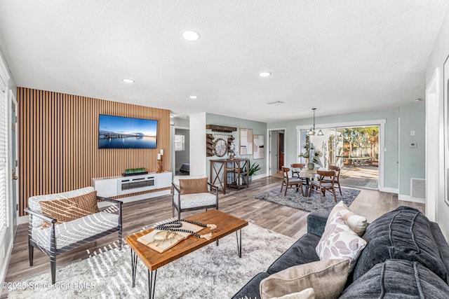 living room featuring hardwood / wood-style flooring and a textured ceiling