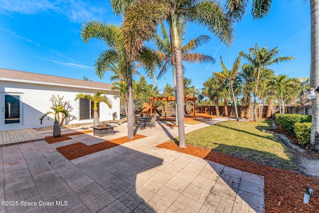 view of patio with an outdoor fire pit