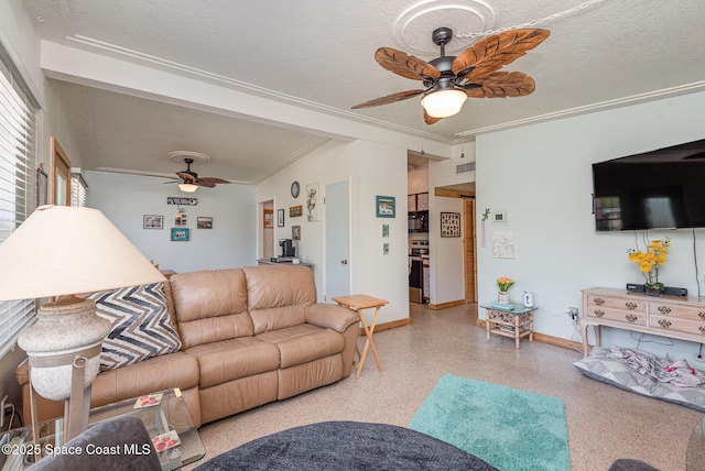 living room featuring ceiling fan, crown molding, and a textured ceiling