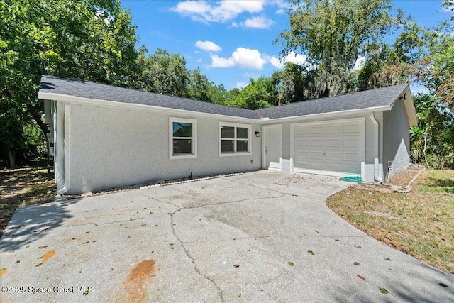 single story home with a garage