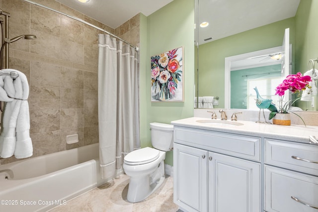 full bathroom featuring shower / bath combination with curtain, vanity, and toilet