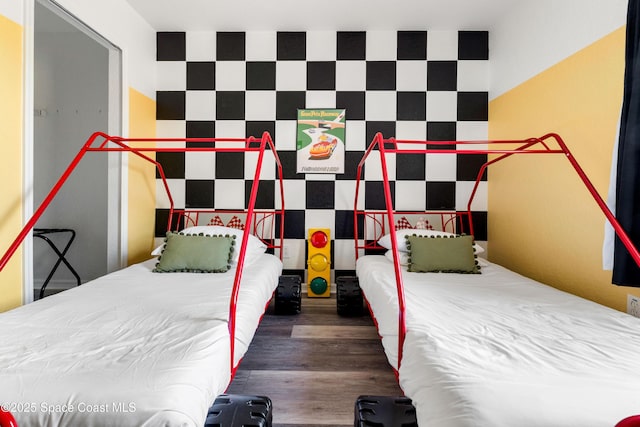 bedroom with dark hardwood / wood-style flooring