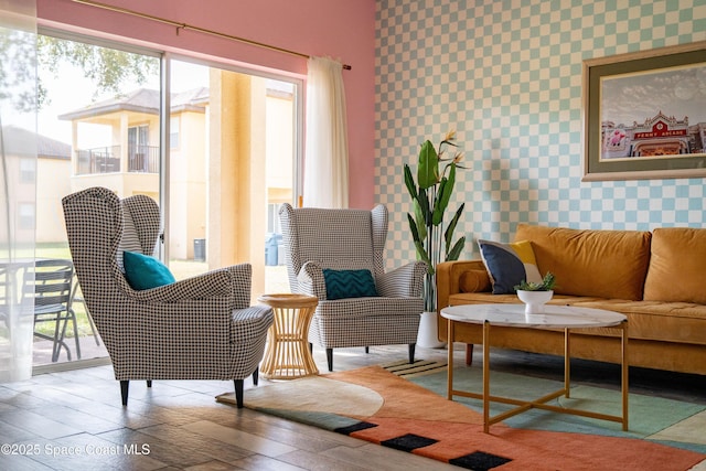 sitting room with hardwood / wood-style floors