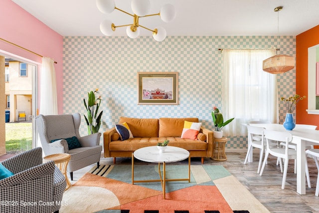 living room featuring hardwood / wood-style flooring and a notable chandelier