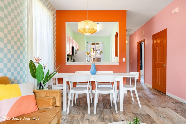 dining area with hardwood / wood-style floors