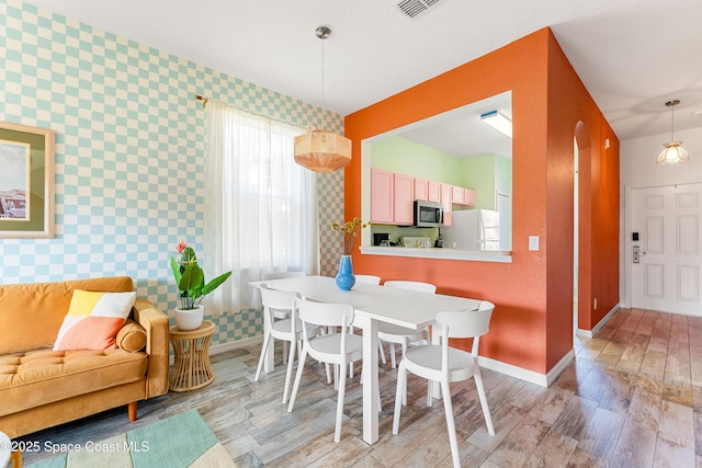 dining room featuring light wood-type flooring