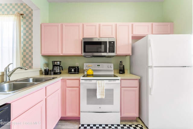 kitchen with white appliances and sink