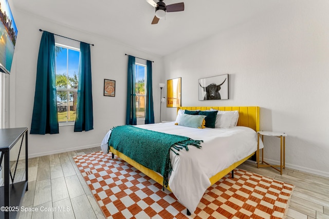 bedroom featuring ceiling fan and light wood-type flooring