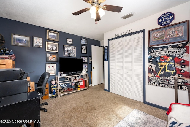 office area with ceiling fan and carpet flooring