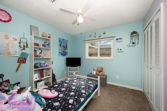 bedroom with ceiling fan, a closet, and carpet