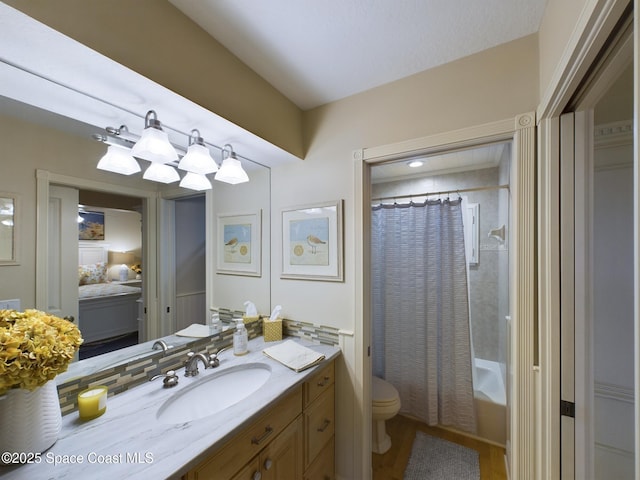 full bathroom with vanity, toilet, and shower / bath combo