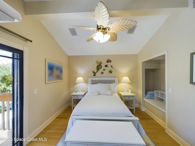 bedroom featuring light hardwood / wood-style floors, vaulted ceiling, and ceiling fan