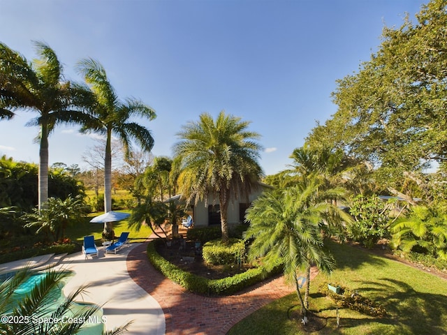 surrounding community featuring a patio