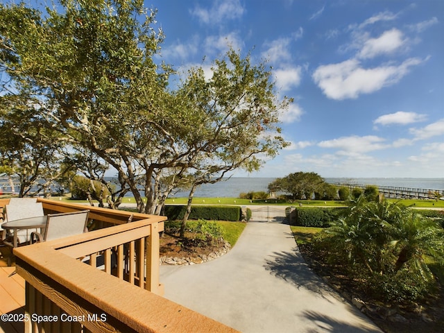 surrounding community featuring a water view