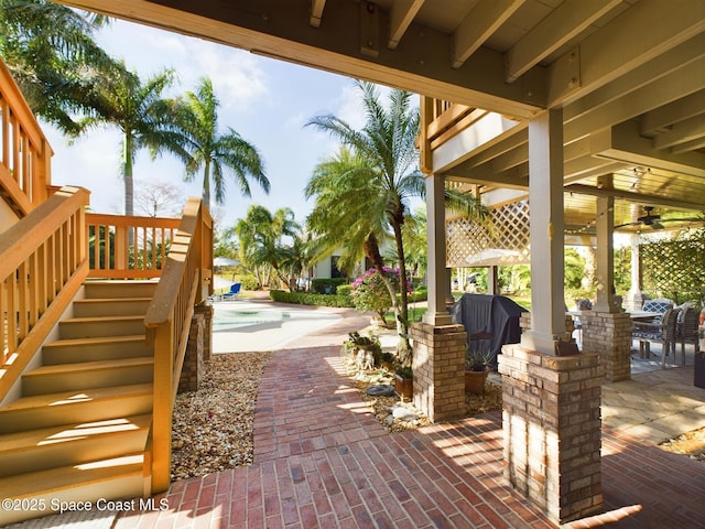 view of patio featuring ceiling fan